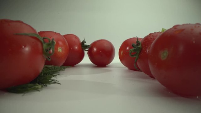 Appetizing fresh summer vegetables. Cherry tomatoes Close-up. Laowa 24 mm MACRO shot. White surface