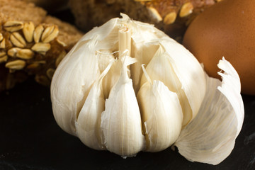 Freshly baked garlic bread with herbs close up