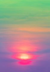 Green and violet color in sky and orange with pink sundown light