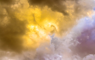 Yellow light in gray fume clouds with dim sky