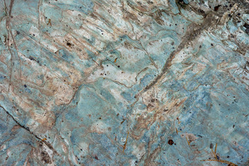 Old rough blue stone surface close-up