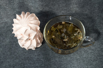 cup of leaf tea and zephyr