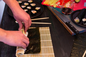 Making homemade sushi, when you can't go out to buy, rice, salmon - obrazy, fototapety, plakaty