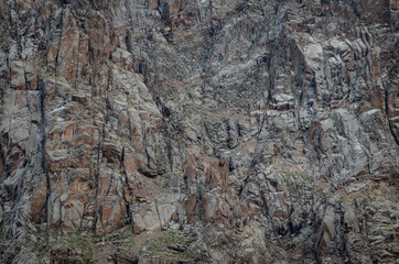 andscape of high rocky mountains with glacier snow-capped peaks and people watching this beauty
