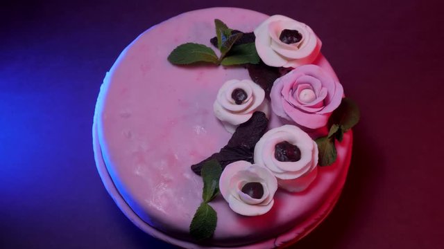 close up of a cake with roses rotation