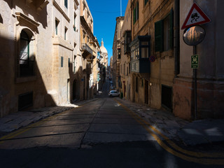 Narrow streets and abrupt descents and climbs of the old city of Valletta. The capital of the island state is Malta.