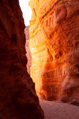 The sun breaks between canyons in the desert, the country of Egypt. Background image
