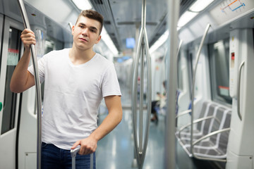 Fototapeta na wymiar Man standing in underground carriage