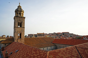 Fototapeta premium Exterior architecture and design of Dubrovnik old town city walls and landscape with clear blue sky, southern Croatia fronting the Adriatic sea encircled with massive stone