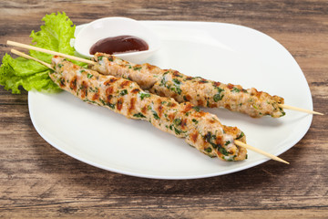 Minced pork skewer kebab with sauce