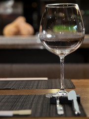 Empty wine glass on a restaurant table