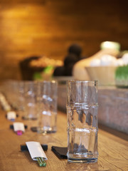 glasses on the table. served table in a fusion restaurant  with open kitchen