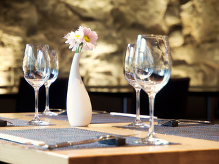 Wine glasses on a served table in fusion style restaurant