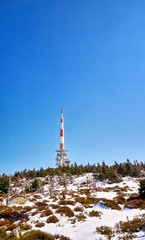 Obraz premium Radio antenna tower on the top of the Brocken mountains. Harz National Park in Germany.
