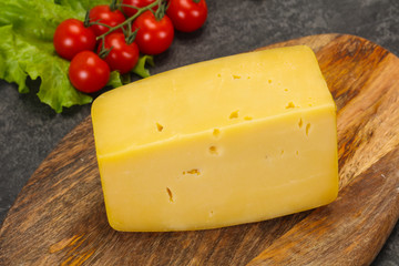 Hard yellow tasty cheese brick