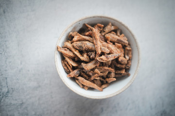 Crispy sweet dried small anchovy fish in bowl