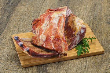 Smoked pork ribs over the wooden background