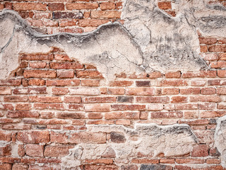 Ancient red brick wall ะexture with cracking of plaster for background