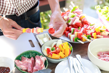 Friends having party and cooking barbecue in gardern.