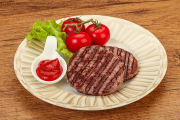 Grilled burger cutlet with sauce