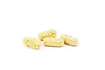 Multivitamin tablets on a white background.