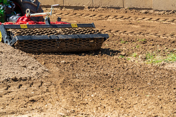 A cultivator plows the land. Agricultural machinery: cultivator for cultivating the soil in the...