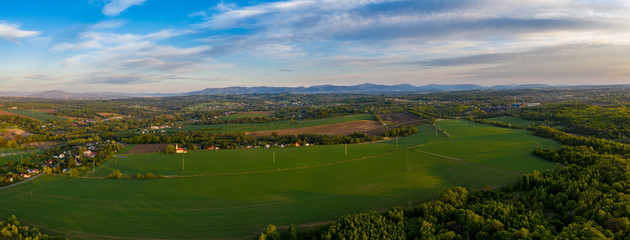 Fototapeta na wymiar aerial view of panorama field and whole beskydy mountains, czech 10.5.2020
