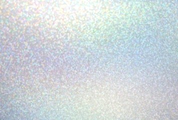 Holographic glitter blurred texture. Shimmer pattern on green pink yellow pastel background. Iridescent gradient.
