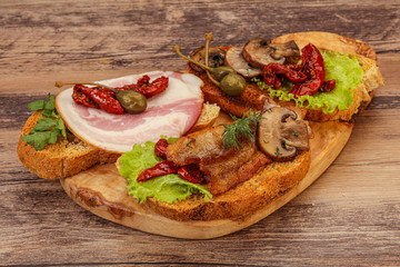 Italian appetizer - bruschetta mix with meat