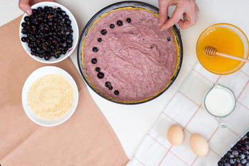 the stages of preparation of a pie with black currants and shortbread crust , fresh berries. the view from the top .