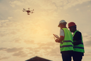 Engineer inspect and checking solar panel by Drone at solar power plant