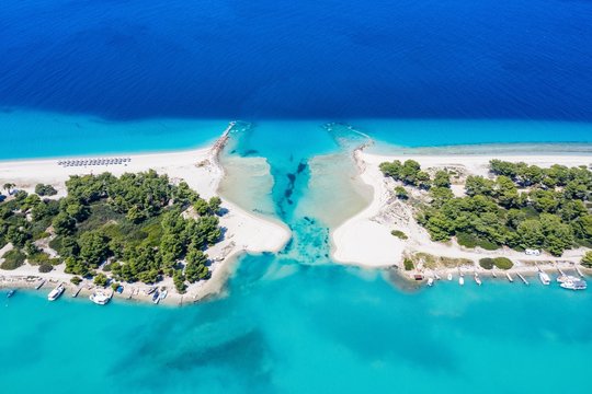 Aerial drone view of Port Glarokavos and lagoon beach in Kassandra penisula Chalkidiki Greece