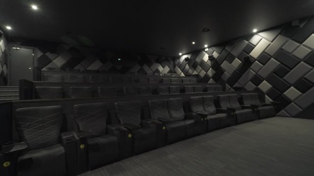 Modern cinema, view of seats in a modern cinema, comfortable chairs in the cinema interior.