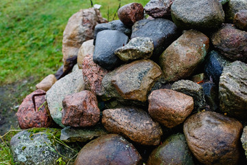 Granite stones, rocks set us background. Big granite stones boulders of various forms. Stone for the background.