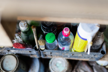 different bottles in the workshop from under the means for