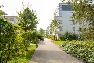 Green residential area with apartment buildings in the city, Europe
