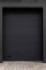 Black door of dark building
