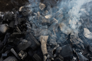the coals texture smoldering and burning in the brazier with smok © gorbacheva777