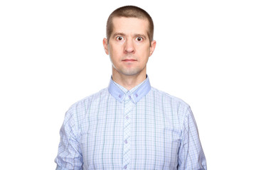 funny unusual man in a classic blue shirt, short haircut and closed mouth; look into the camera. Isolated