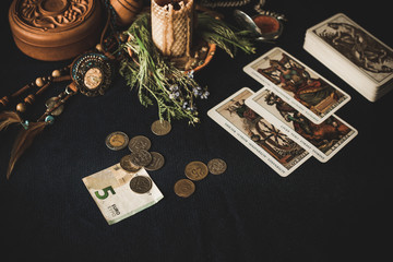 Naklejka na ściany i meble Magic for attracting money, rituals and fate prediction, details on a table of witch, occultism concept