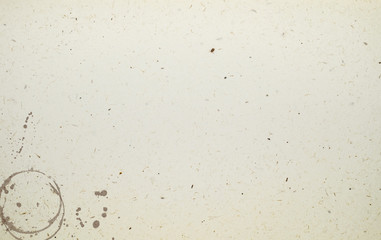 Sheet of paper with coffee ring stains and smudges