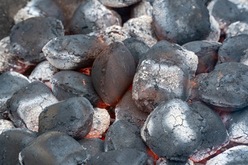 Charcoal briquettes ready for barbecue grill, beautiful fire. Grill ignition.