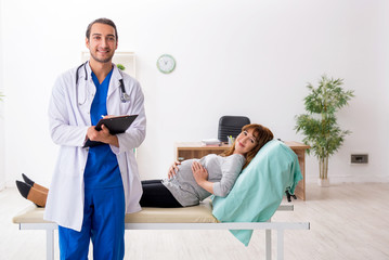 Young woman visting young male doctor gynecologist