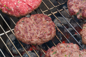 BBQ Grilled Burgers Patties On The Hot Flaming Charcoal Grill, Top View. Cookout Food