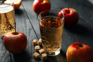 Composition with cider, sugar and apples on wooden background