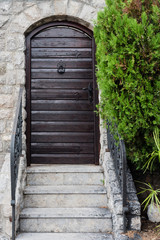 Fototapeta na wymiar Old wooden door with metallic doorlock