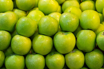 Close up green apples background.
