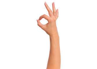 Female hand showing OK gesture, isolated on white background. Beautiful hand of woman with copy...