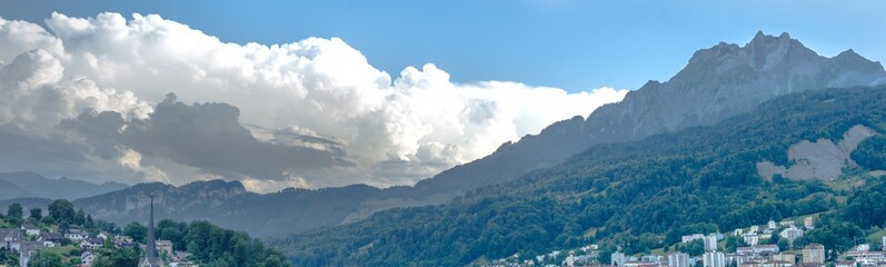 panorama clouds are approaching mount pilatus and turning into a summer thunderstorm