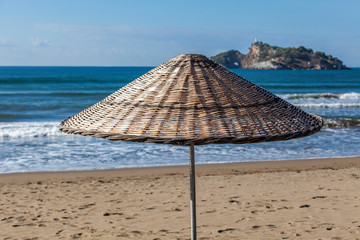 beach with umbrella, iztuzu beach, Dalyan, Turkey.